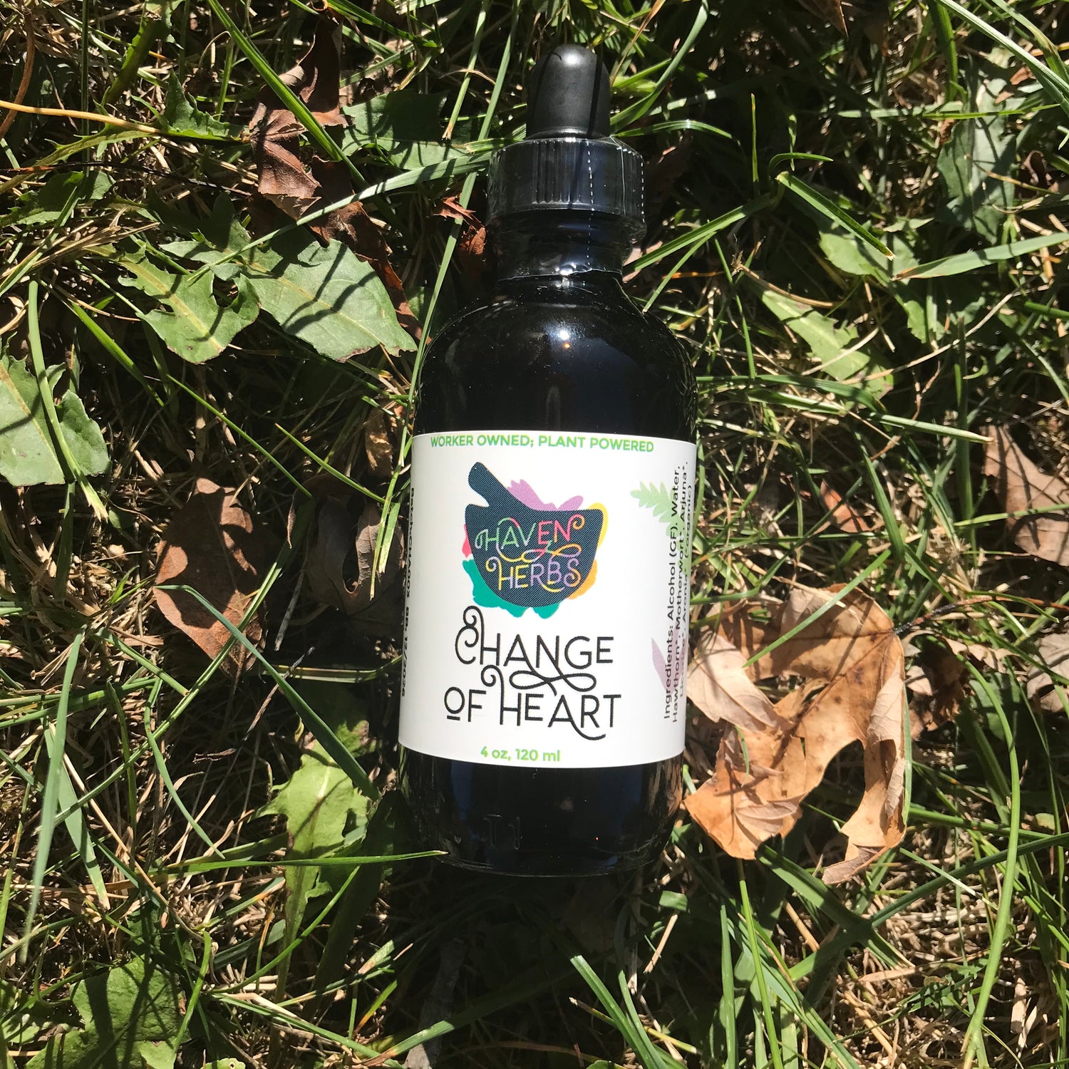 4 oz bottle named Change of Heart on a grassy background